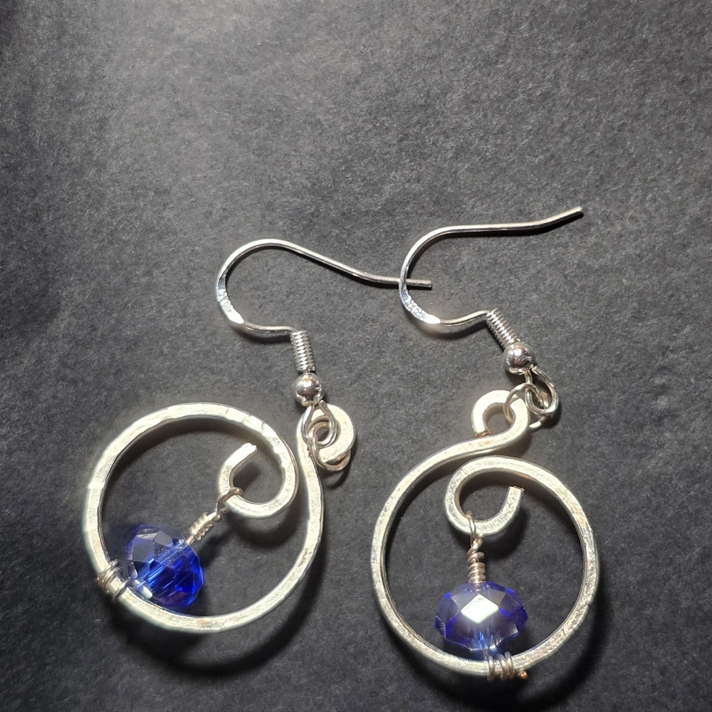 Elegant Silver Swirl Earrings with Blue Accent